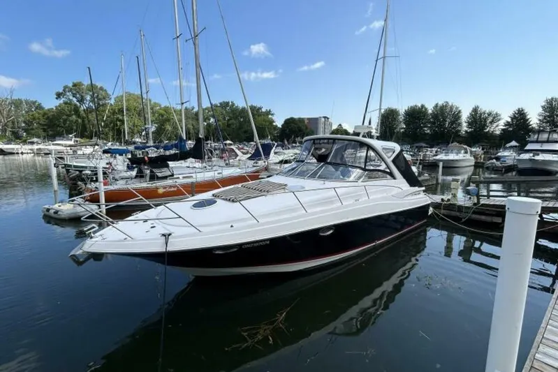  Yacht Photos Pics 2007 Regal 3760 Commodore yacht docked in a marina, surrounded by sailboats.
