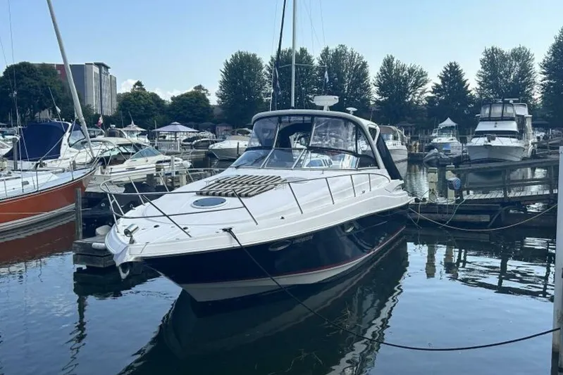  Yacht Photos Pics 2007 Regal 3760 Commodore yacht docked at a marina, surrounded by other boats.