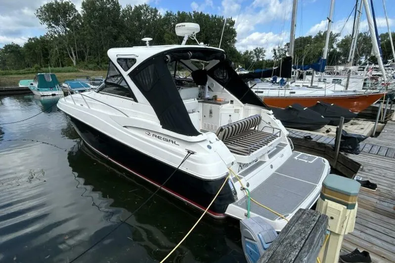  Yacht Photos Pics 2007 Regal 3760 Commodore yacht docked at marina, featuring sleek design and spacious deck.