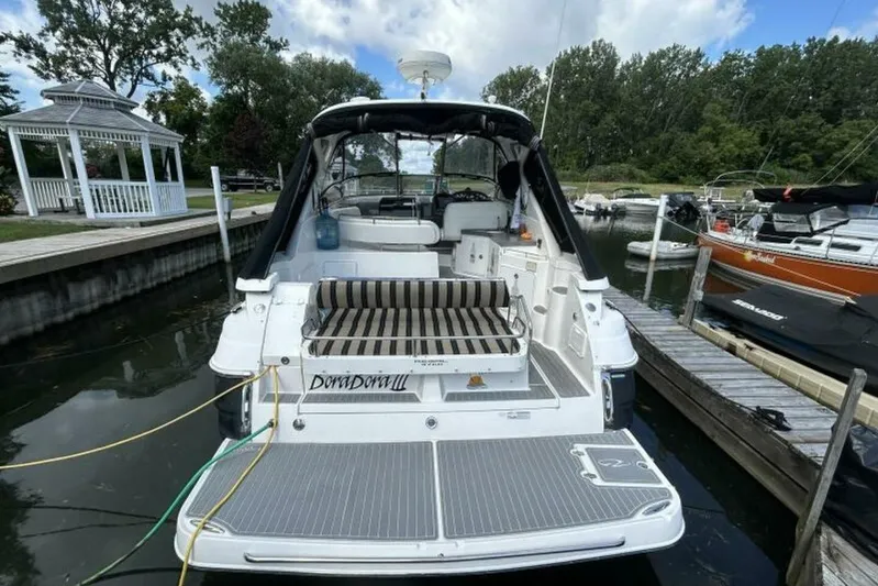  Yacht Photos Pics 2007 Regal 3760 Commodore boat docked at marina with striped seating and gazebo nearby.