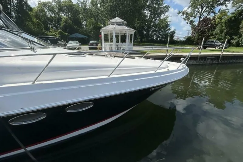  Yacht Photos Pics 2007 Regal 3760 Commodore yacht docked near a gazebo on a sunny day.