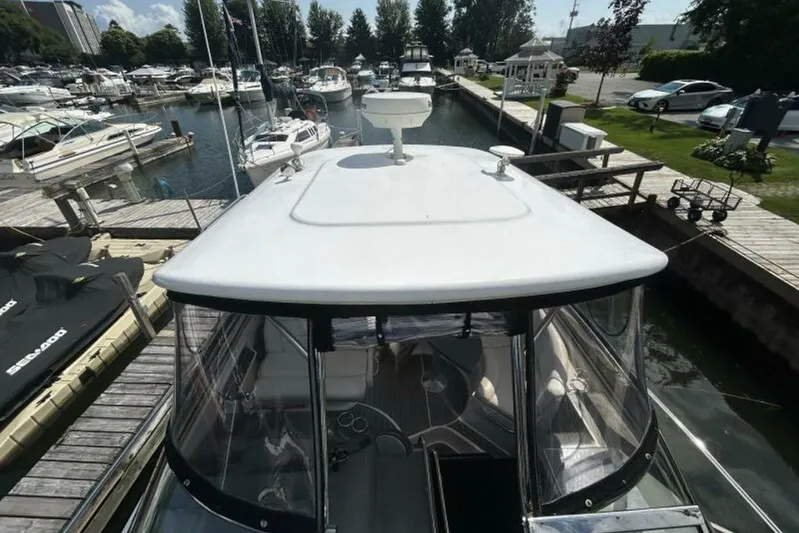  Yacht Photos Pics 2007 Regal 3760 Commodore yacht docked at marina, surrounded by other boats.