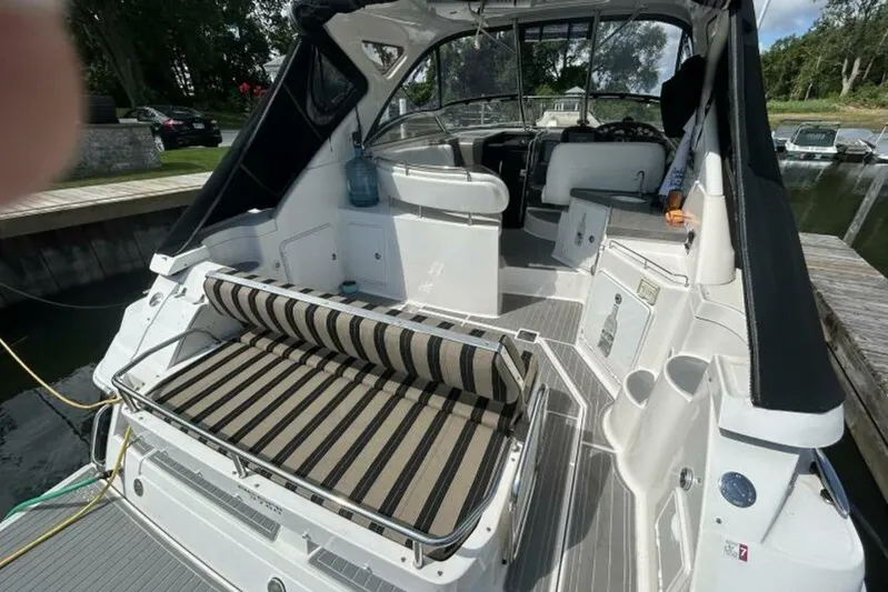  Yacht Photos Pics 2007 Regal 3760 Commodore yacht interior with striped seating and modern amenities.