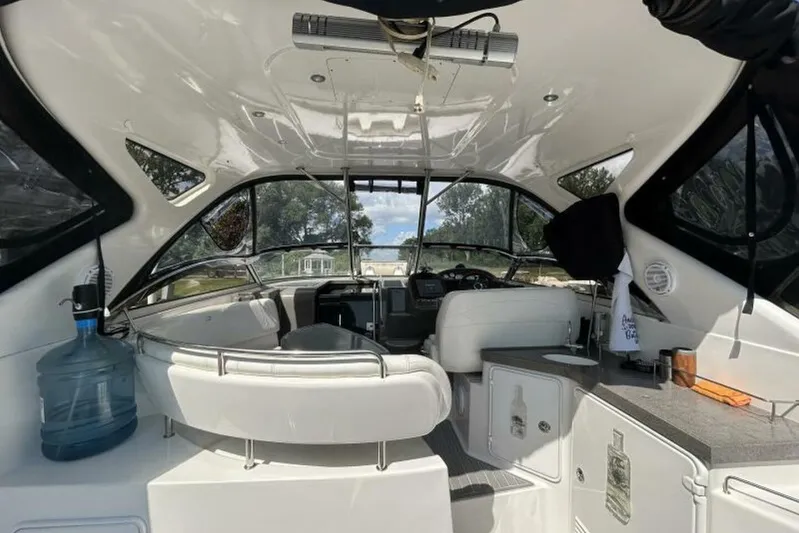  Yacht Photos Pics Interior of a 2007 Regal 3760 Commodore yacht with seating and helm.