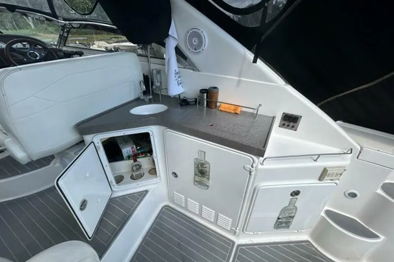  Yacht Photos Pics 2007 Regal 3760 Commodore boat interior with kitchenette and seating area.