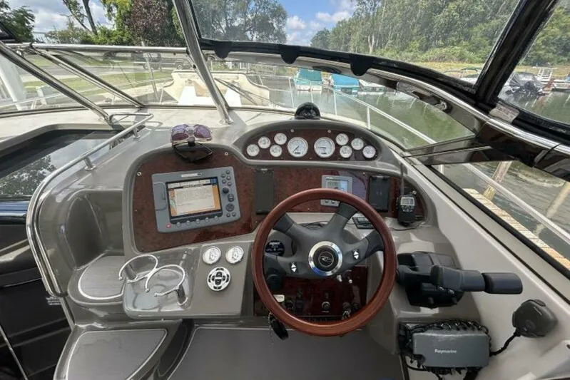  Yacht Photos Pics 2007 Regal 3760 Commodore boat dashboard with steering wheel and navigation instruments.
