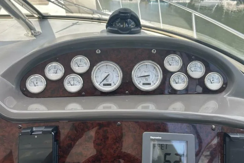  Yacht Photos Pics Dashboard of a 2007 Regal 3760 Commodore boat with gauges and navigation equipment.