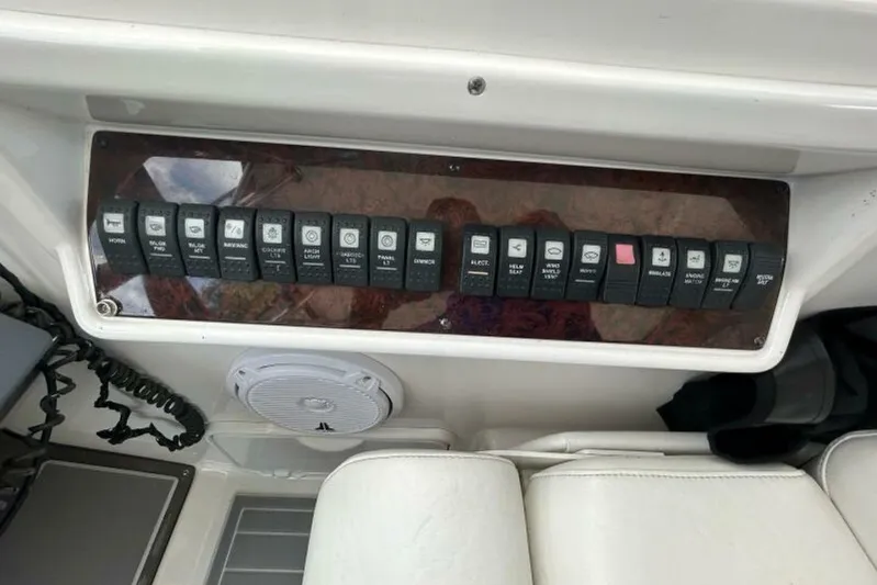  Yacht Photos Pics Control panel of a 2007 Regal 3760 Commodore boat with labeled switches.