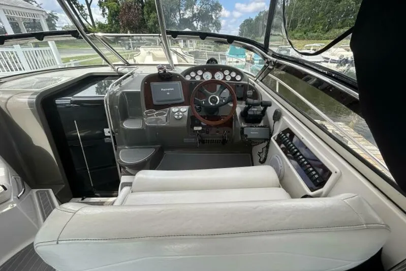  Yacht Photos Pics 2007 Regal 3760 Commodore boat cockpit with steering wheel and control panel.