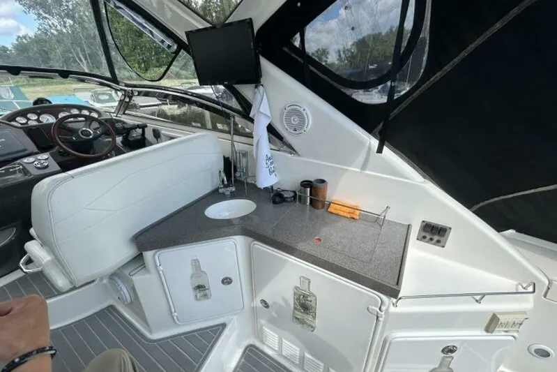  Yacht Photos Pics 2007 Regal 3760 Commodore yacht interior with helm, seating, and kitchenette area.