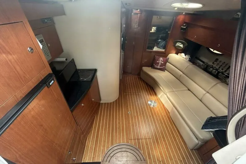  Yacht Photos Pics Luxurious interior of 2007 Regal 3760 Commodore yacht with wood flooring and leather seating.