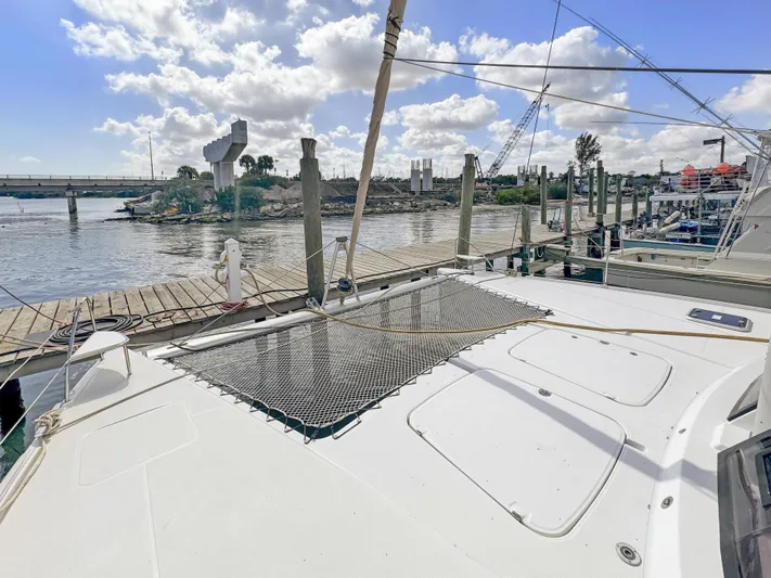 Alisei Yacht Photos Pics Fountaine Pajot Helia 44 Evolution 2017 catamaran docked at a marina under a blue sky.