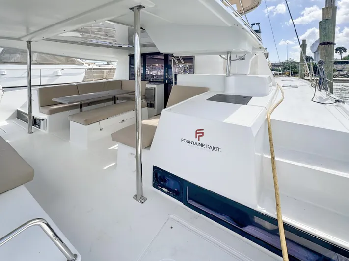 Alisei Yacht Photos Pics 2017 Fountaine Pajot Helia 44 Evolution catamaran with spacious deck and seating area.
