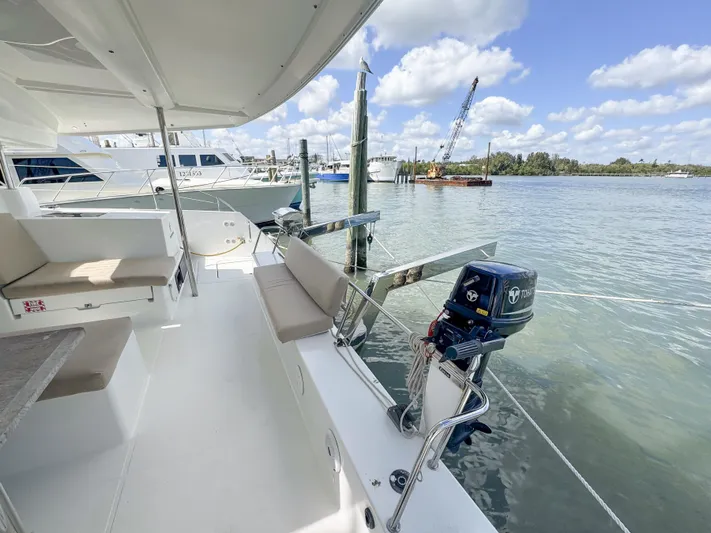 Alisei Yacht Photos Pics 2017 Fountaine Pajot Helia 44 Evolution catamaran docked, featuring spacious deck and seating.