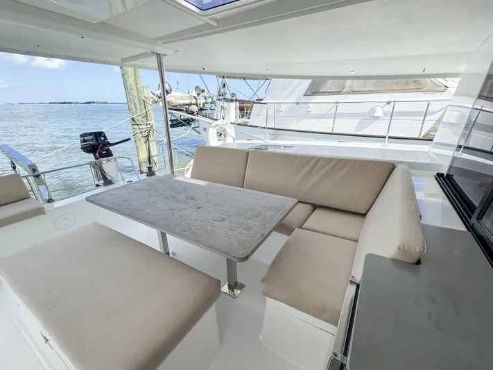 Alisei Yacht Photos Pics 2017 Fountaine Pajot Helia 44 Evolution yacht with spacious outdoor seating area.