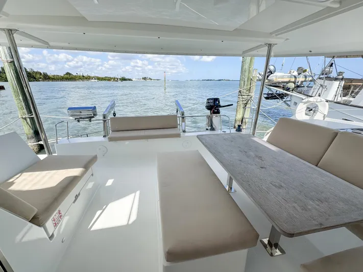 Alisei Yacht Photos Pics 2017 Fountaine Pajot Helia 44 Evolution catamaran with spacious outdoor seating and ocean view.