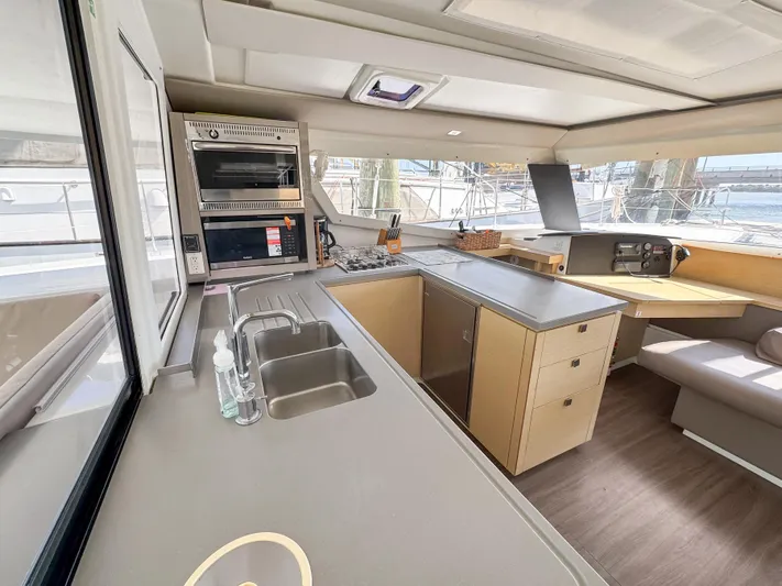Alisei Yacht Photos Pics Modern kitchen interior of 2017 Fountaine Pajot Helia 44 Evolution catamaran.