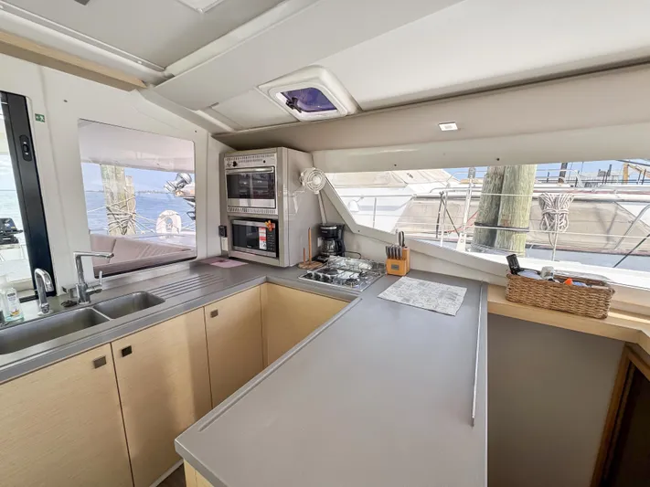 Alisei Yacht Photos Pics Modern kitchen interior of 2017 Fountaine Pajot Helia 44 Evolution catamaran.