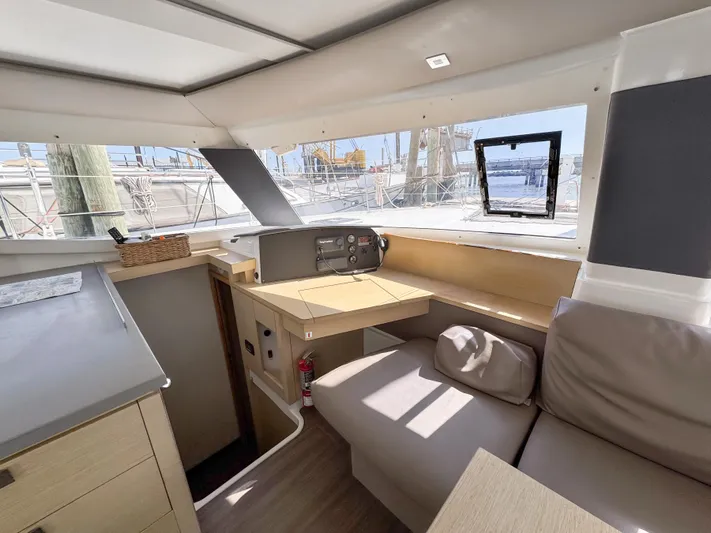 Alisei Yacht Photos Pics Interior of 2017 Fountaine Pajot Helia 44 Evolution catamaran with modern seating and navigation area.
