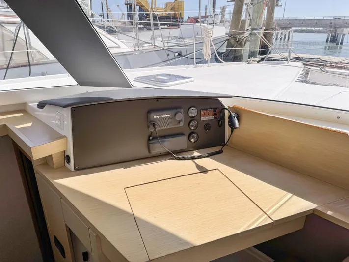 Alisei Yacht Photos Pics Helm station of 2017 Fountaine Pajot Helia 44 Evolution catamaran, featuring navigation equipment.