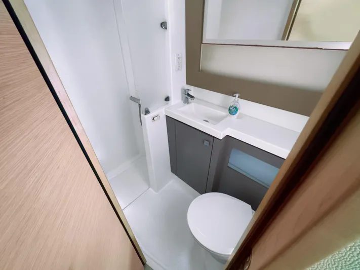 Alisei Yacht Photos Pics Modern bathroom in 2017 Fountaine Pajot Helia 44 Evolution yacht, featuring sleek design and compact amenities.