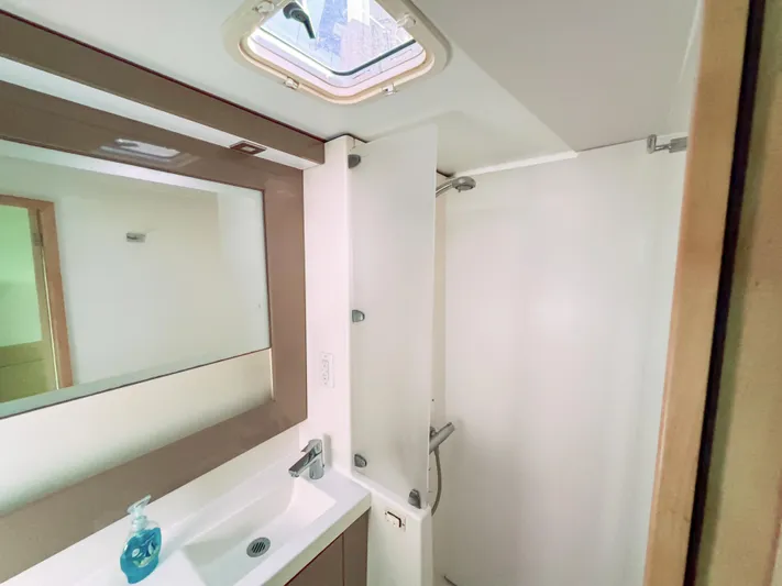 Alisei Yacht Photos Pics Bathroom interior of 2017 Fountaine Pajot Helia 44 Evolution yacht, featuring modern fixtures.