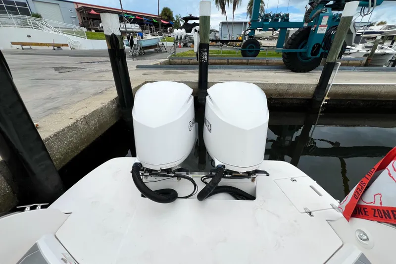  Yacht Photos Pics 2019 Regal 29 OBX boat with twin Yamaha outboard engines at a marina dock.