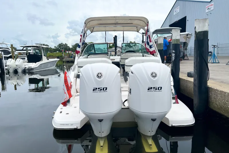  Yacht Photos Pics 2019 Regal 29 OBX boat with twin 250 horsepower engines docked at marina.