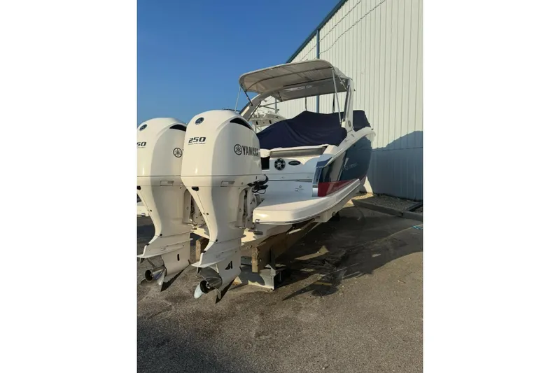  Yacht Photos Pics 2019 Regal 29 OBX boat with twin Yamaha 250 engines, docked outdoors.