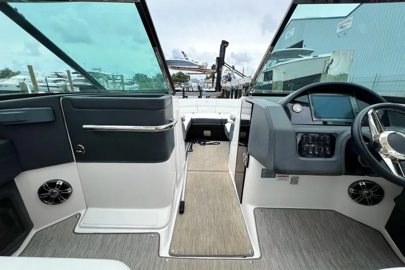  Yacht Photos Pics 2019 Regal 29 OBX boat interior with modern dashboard and spacious seating.