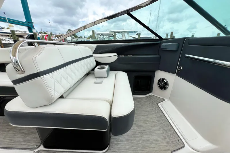  Yacht Photos Pics Luxurious interior of 2019 Regal 29 OBX boat with plush seating and modern design.