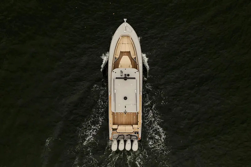  Yacht Photos Pics Aerial view of 2026 HCB 42 Lujo boat cruising on dark water.