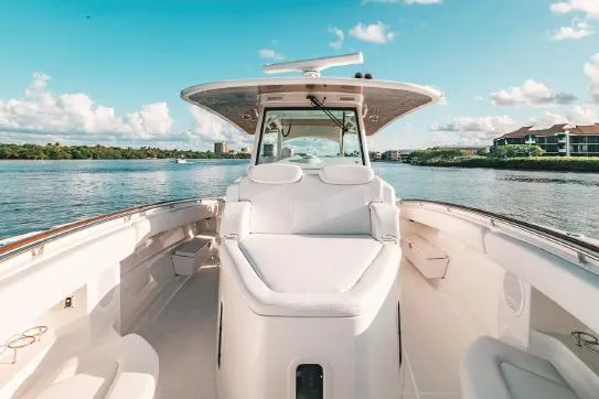 Yacht Photos Pics 2026 HCB 42 Lujo boat on calm water, featuring luxurious seating and clear skies.