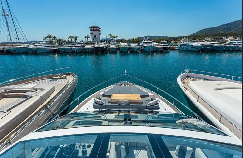  Yacht Photos Pics Luxury Pearl 80 yacht docked in marina, surrounded by other boats, clear blue sky.