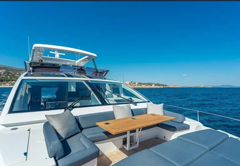  Yacht Photos Pics Luxurious 2020 Pearl 80 yacht with spacious deck seating and ocean view.