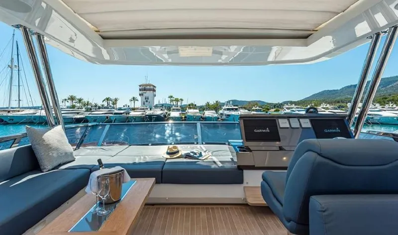  Yacht Photos Pics Luxurious Pearl 80 yacht interior with marina view, featuring plush seating and modern amenities, 2020 model.