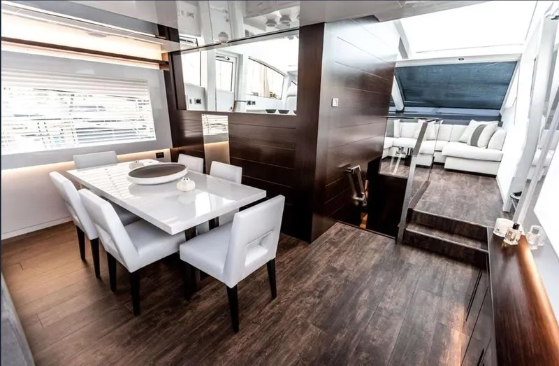  Yacht Photos Pics Luxurious interior of 2020 Pearl 80 yacht with elegant dining area and modern decor.