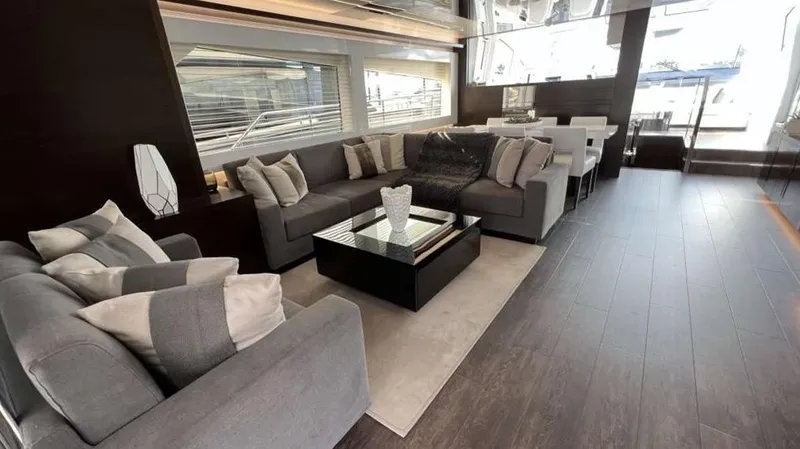  Yacht Photos Pics Luxurious interior of 2020 Pearl 80 yacht with modern seating and dining area.