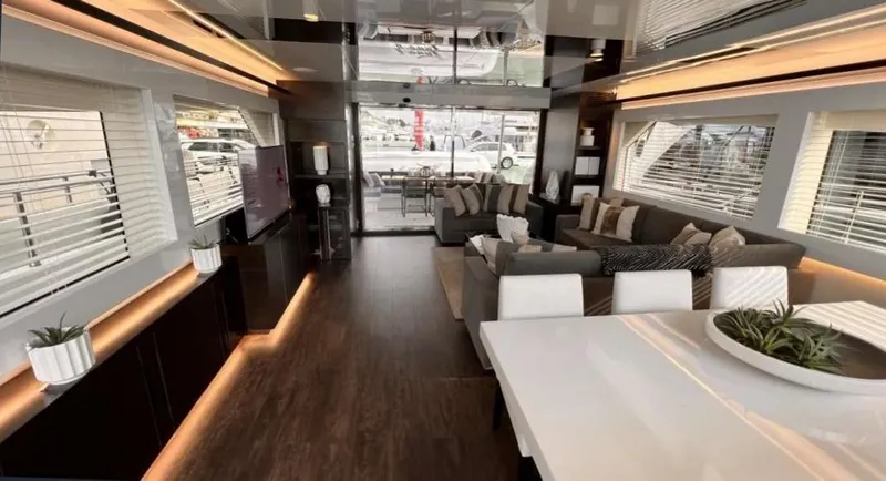  Yacht Photos Pics Luxurious interior of a 2020 Pearl 80 yacht with modern furnishings and ambient lighting.
