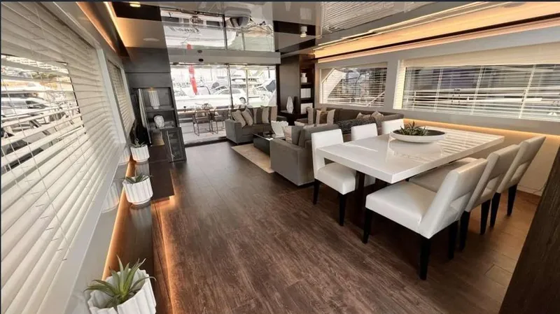  Yacht Photos Pics Luxurious Pearl 80 yacht interior, 2020 model, featuring elegant dining and seating areas with modern decor.
