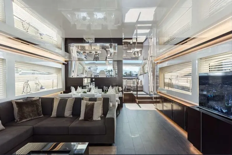  Yacht Photos Pics Luxurious interior of a 2020 Pearl 80 yacht with modern furnishings and elegant dining area.