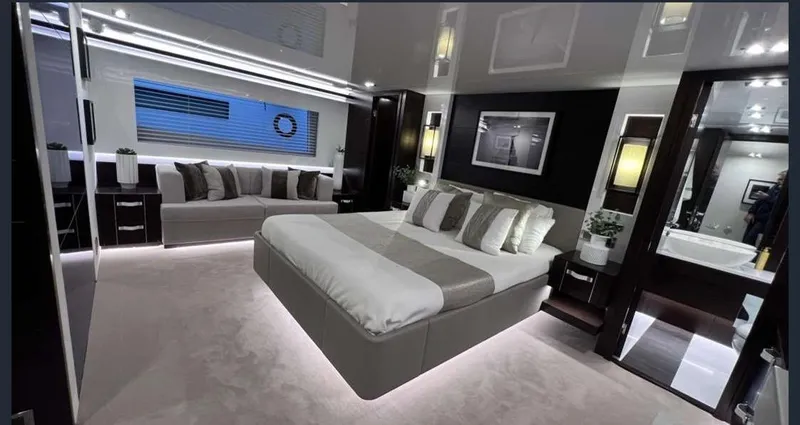  Yacht Photos Pics Luxurious bedroom interior in a 2020 Pearl 80 yacht, featuring modern design and elegant furnishings.