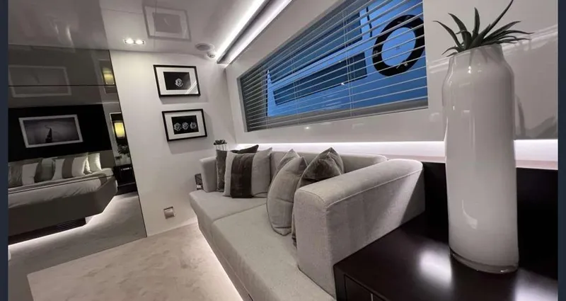  Yacht Photos Pics Luxurious interior of a 2020 Pearl 80 yacht with modern decor and comfortable seating.