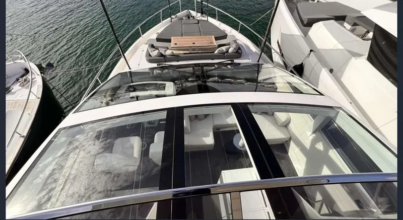  Yacht Photos Pics Luxury Pearl 80 yacht, 2020 model, with spacious deck and sleek design, docked on water.