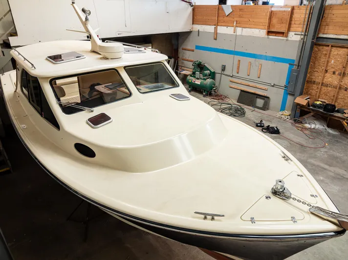 Rough Rider Yacht Photos Pics 2006 Palm Beach Motor Yachts Avalon 32 in a workshop setting.