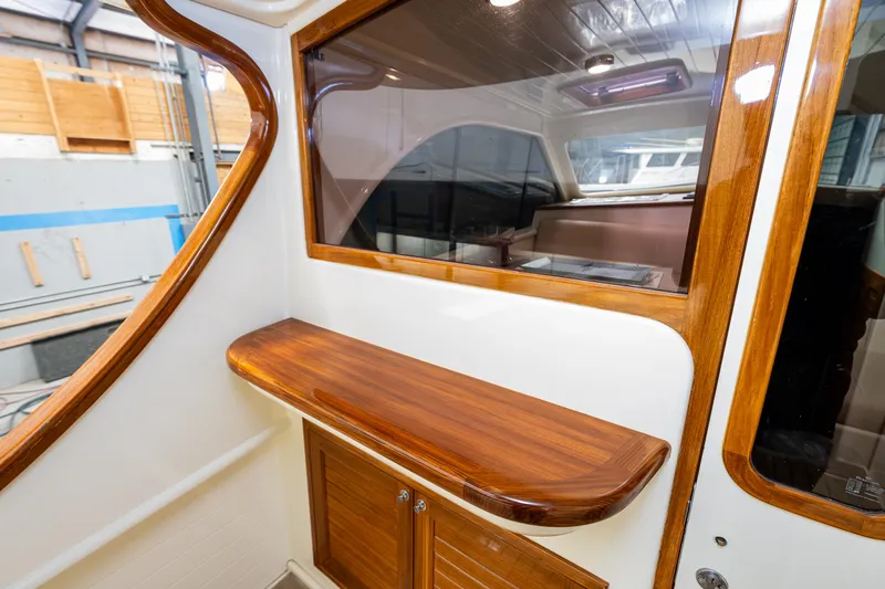 Rough Rider Yacht Photos Pics 2006 Palm Beach Motor Yachts Avalon 32 interior with elegant wood finish and cabinetry.