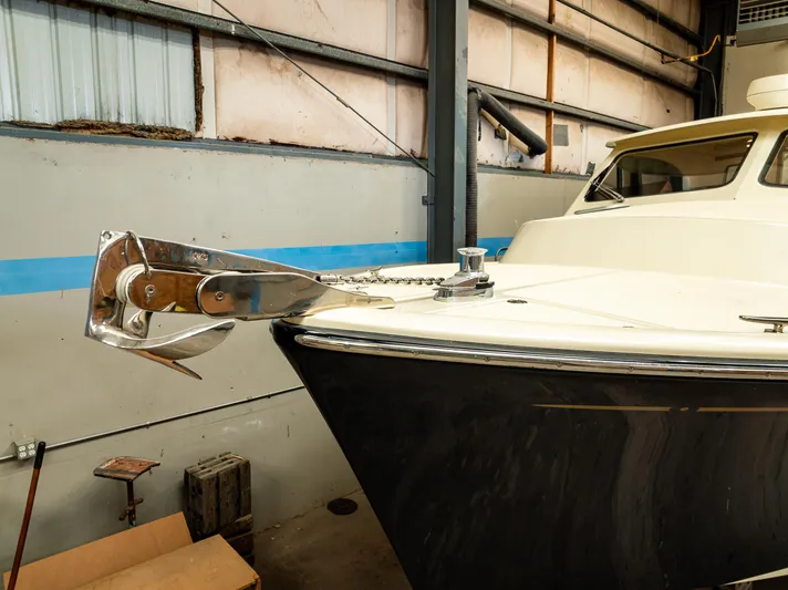 Rough Rider Yacht Photos Pics 2006 Palm Beach Motor Yachts Avalon 32 in storage, showcasing bow and anchor detail.