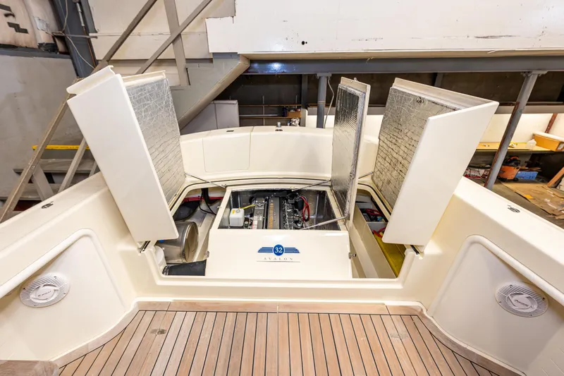 Rough Rider Yacht Photos Pics Engine compartment of 2006 Palm Beach Motor Yachts Avalon 32, open for maintenance.