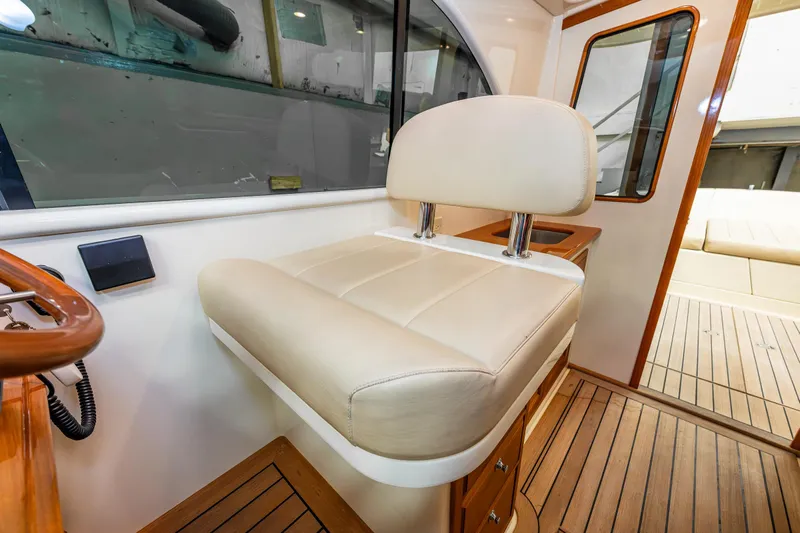 Rough Rider Yacht Photos Pics Luxurious interior of 2006 Palm Beach Motor Yachts Avalon 32 with cream leather seating.