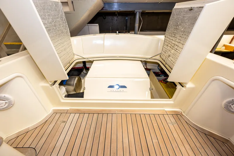 Rough Rider Yacht Photos Pics 2006 Palm Beach Motor Yachts Avalon 32 interior with open storage compartments.